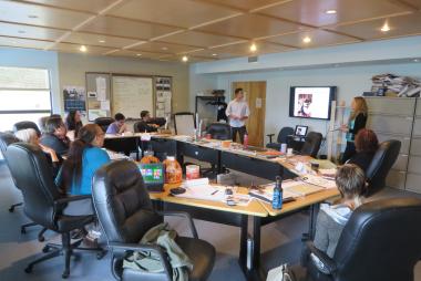 Two students giving a presentation to a conference room