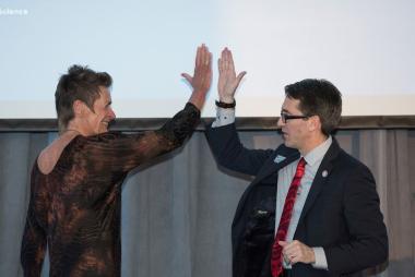 A professor and a dean high-fiving